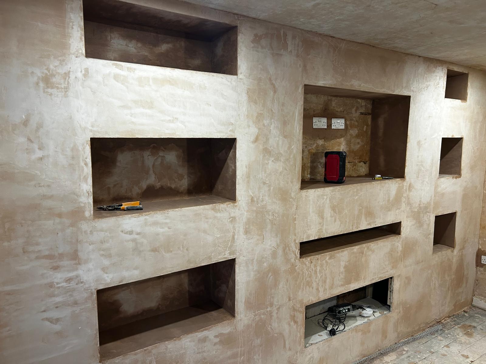 Custom built-in shelving and plastering
