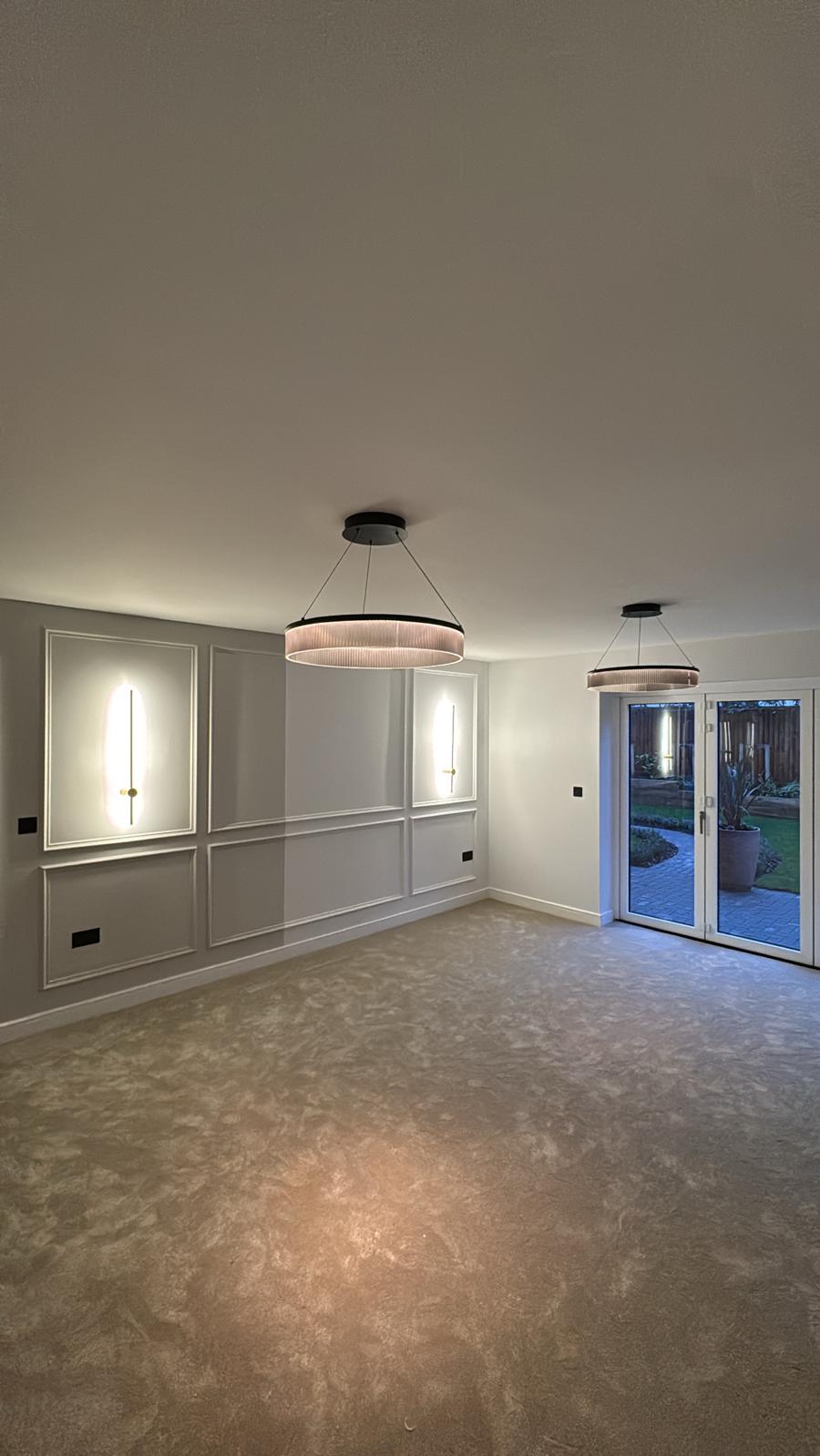Completed living room with designer lighting and panelling